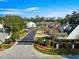 View of gated community with manicured landscaping and well-maintained exteriors under a sunny sky at 231 Ne 28Th Ave # 103, Ocala, FL 34470