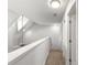 Second floor hallway with carpet and open railing overlooking the first floor at 231 Ne 28Th Ave # 103, Ocala, FL 34470