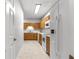 Kitchen view featuring wood cabinets with white countertops and appliances at 231 Ne 28Th Ave # 103, Ocala, FL 34470