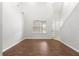 Bright living room features soaring ceilings, large windows, and elegant wood flooring at 231 Ne 28Th Ave # 103, Ocala, FL 34470