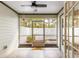 Relaxing screened porch with tiled floors and a view of the fenced yard at 231 Ne 28Th Ave # 103, Ocala, FL 34470