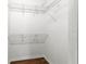 Walk-in closet with white wire shelving, providing practical and organized storage solutions at 231 Ne 28Th Ave # 103, Ocala, FL 34470