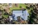 Aerial view showcases the property's layout, roof, and surrounding greenery at 25 Lake Wood Cir, Ocala, FL 34482