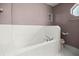 A bathroom with a large bathtub and a tiled surround at 25 Lake Wood Cir, Ocala, FL 34482