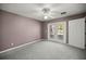 Bedroom featuring new carpet and access to the outdoor space at 25 Lake Wood Cir, Ocala, FL 34482