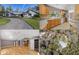 Property collage featuring the home's exterior, kitchen with granite countertops, living room with hardwood floors, and an aerial view at 25 Lake Wood Cir, Ocala, FL 34482