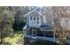 Charming two-story home with screened porch and balcony overlooking landscaped front yard at 25 Lake Wood Cir, Ocala, FL 34482