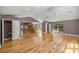 Spacious living area boasts hardwood floors, vaulted ceiling, and natural light at 25 Lake Wood Cir, Ocala, FL 34482