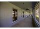 A covered outdoor patio with a backyard view at 25 Lake Wood Cir, Ocala, FL 34482