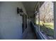 A covered patio with views of the landscaped grounds at 25 Lake Wood Cir, Ocala, FL 34482