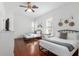 Spacious bedroom with wood floors and two beds, perfect for guests or children at 30 Se Wenona Ave, Ocala, FL 34471