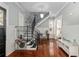 Elegant foyer featuring hardwood floors, decorative staircase, and inviting entryway at 30 Se Wenona Ave, Ocala, FL 34471