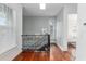 Upstairs hallway with detailed iron railing and hardwood floors at 30 Se Wenona Ave, Ocala, FL 34471