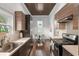 Stylish eat-in kitchen boasts dark wood floors and modern appliances at 30 Se Wenona Ave, Ocala, FL 34471