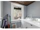 Well-lit laundry room with a modern washer and dryer and a view of the backyard at 30 Se Wenona Ave, Ocala, FL 34471