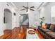 Bright living room featuring hardwood floors, tray ceiling, and neutral decor at 30 Se Wenona Ave, Ocala, FL 34471