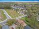 The aerial view captures the neighborhood layout and nearby natural surroundings at 3650 Ne 21St St, Ocala, FL 34470