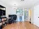 Open living space featuring wood-look floors, chandelier, and view to the kitchen at 3650 Ne 21St St, Ocala, FL 34470