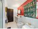 Stylish bathroom featuring bright walls, a modern vanity, and unique fixtures for a spa-like experience at 411 Sw 38Th St, Ocala, FL 34471