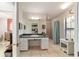 Bright bathroom featuring a vanity with green marble countertop and a walk-in shower at 411 Sw 38Th St, Ocala, FL 34471