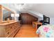 Bedroom with wood floors, desk and dresser at 411 Sw 38Th St, Ocala, FL 34471