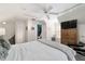Bright bedroom with neutral walls, a large window, a ceiling fan and ample closet space at 411 Sw 38Th St, Ocala, FL 34471