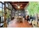 Bright dining room with a wood ceiling, tile floors, table, and chairs at 411 Sw 38Th St, Ocala, FL 34471