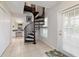 Hallway with a spiral staircase with access to the bathroom at 411 Sw 38Th St, Ocala, FL 34471