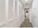 Hallway view featuring built-in storage, and adjacent walk-in closet at 411 Sw 38Th St, Ocala, FL 34471
