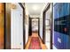 Hallway with hardwood floors leading to the main bedroom and bathroom at 411 Sw 38Th St, Ocala, FL 34471