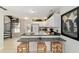 Bright kitchen featuring bar-style seating and modern appliances at 411 Sw 38Th St, Ocala, FL 34471