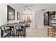 Bright and airy living space with tile floors, ceiling fan, and access to kitchen and dining areas at 411 Sw 38Th St, Ocala, FL 34471