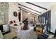 Bright living area boasts vaulted ceilings, stone accents, comfortable seating, and grand piano at 411 Sw 38Th St, Ocala, FL 34471
