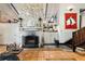 Living room features a stone fireplace, wet bar, and terracotta tile floors at 411 Sw 38Th St, Ocala, FL 34471