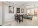 Bright and airy living space with tile floors, ceiling fan, and access to other rooms at 411 Sw 38Th St, Ocala, FL 34471