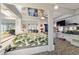 Spacious bedroom with mirrored ceilings, unique bed frame, and bold patterned carpeting at 411 Sw 38Th St, Ocala, FL 34471