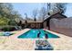 Backyard pool with an outdoor patio and view of the sun room at 411 Sw 38Th St, Ocala, FL 34471