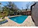 Inviting in-ground pool with brick surround offers the perfect backyard space for relaxing and entertaining at 411 Sw 38Th St, Ocala, FL 34471