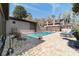 Rear of the home showcasing a pristine in-ground pool with a brick paver surround and views of the main house at 411 Sw 38Th St, Ocala, FL 34471