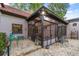 Exterior view of home featuring a sun room, brick patio, and outdoor seating at 411 Sw 38Th St, Ocala, FL 34471
