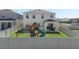Backyard featuring a playground, fenced perimeter, and a covered patio with an outdoor dining set at 5021 Sw 88Th St, Ocala, FL 34476