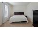 This bedroom is a calm and inviting space with soft lighting and a neutral color palette, perfect for relaxation and rest at 5021 Sw 88Th St, Ocala, FL 34476