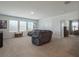 Spacious bonus room offers ample seating and carpet floors at 5021 Sw 88Th St, Ocala, FL 34476