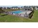 Community pool featuring comfortable lounge chairs and shade for relaxation and enjoyment at 5021 Sw 88Th St, Ocala, FL 34476