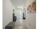 Welcoming entryway with neutral tones, tile flooring, and ample space for organization and decor at 5021 Sw 88Th St, Ocala, FL 34476