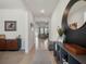 Bright entryway featuring neutral decor and tile flooring, leading into an open-concept living space at 5021 Sw 88Th St, Ocala, FL 34476