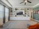 Comfortable living room features custom built-ins and a ceiling fan at 5021 Sw 88Th St, Ocala, FL 34476