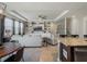 Bright living room features built-in shelving, ceiling fan, and neutral color palette at 5021 Sw 88Th St, Ocala, FL 34476