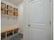 Mudroom with built-in storage and bench, ideal for organizing shoes, bags, and outdoor gear at 5021 Sw 88Th St, Ocala, FL 34476