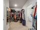 A well-organized walk-in closet with shelves, hanging rods, and storage bins, offering ample space for clothing and accessories at 5021 Sw 88Th St, Ocala, FL 34476